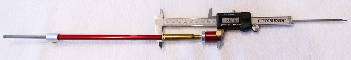 Measurement set up for cartridge ogive length (OAL) when the bullet touches the rifling.